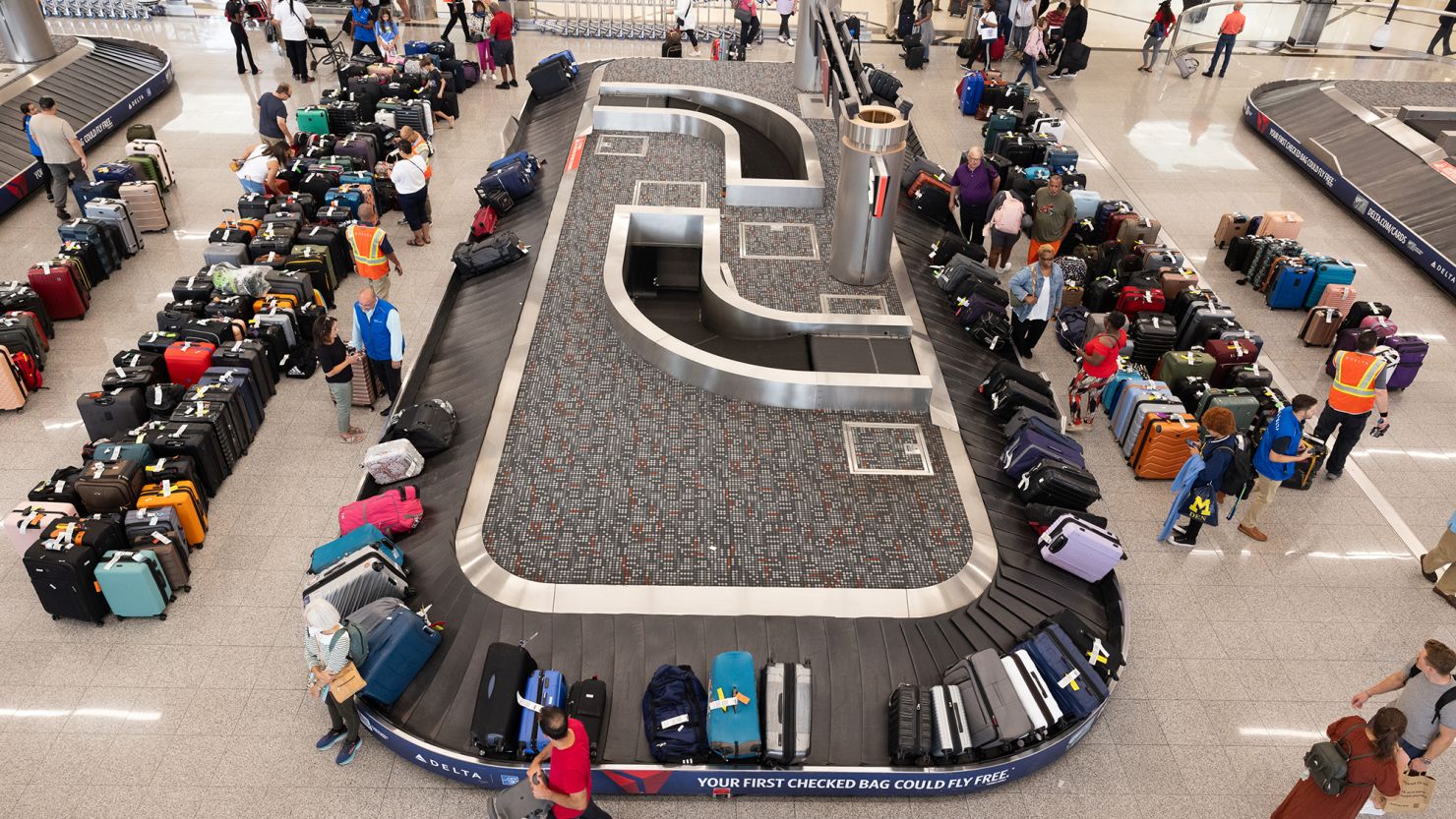 Delta passengers try to find their bags after cancelled and delayed flights at Hartsfield-Jackson Atlanta International Airport on July 22, 2024 in Atlanta, Georgia.