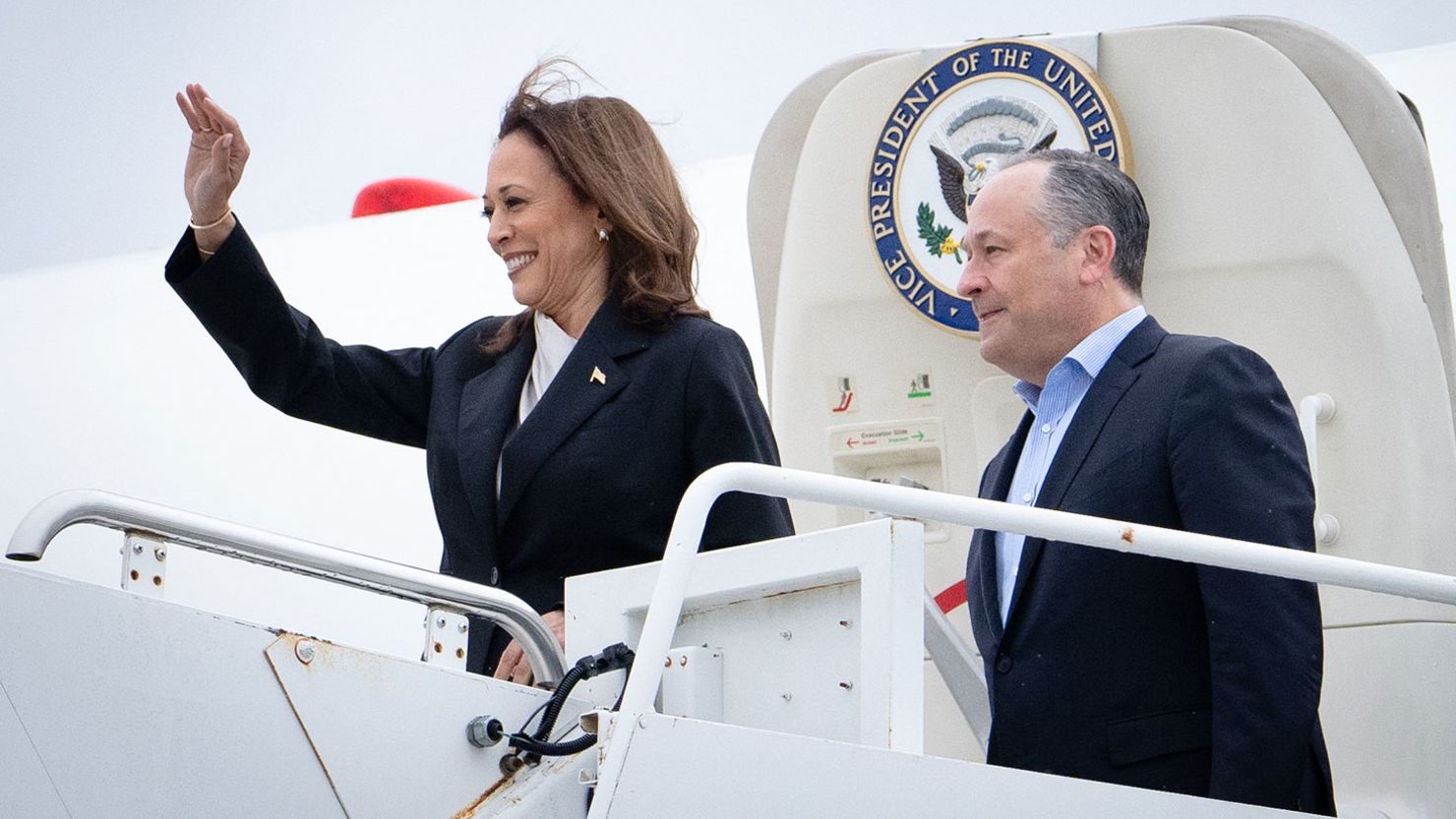 US Vice President Kamala Harris and second gentleman Douglas Emhoff descend from Air Force Two at Delaware National Air Guard base in New Castle, Delaware, on July 22, 2024.