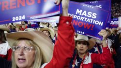 People hold signs reading "Mass Deportation Now!" during the Republican National Convention in Milwaukee on July 17.