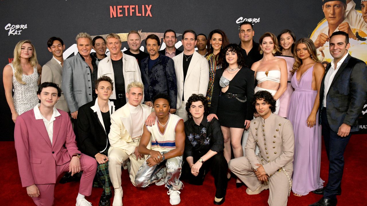 LOS ANGELES, CALIFORNIA - JULY 17: (L-R) Peyton List, Gianni DeCenzo, Daniel Kim, Martin Kove, Yuji Okumoto, Jacob Bertrand, William Zabka, Josh Heald, Tanner Buchanan, Ralph Macchio, Dallas Dupree Young, Jon Hurwitz, Hayden Schlossberg, Griffin Santopietro, Caleeb Pinkett, Vanessa Rubio, Mary Mouser, Bret Ernst, Xolo Maridueña, Courtney Henggeler, Oona O'Brien, Hannah Kepple and Dan Ahdoot attend Cobra Kai Season 6 Part 1 - Special Fan Event at Autry Museum at Griffith Park on July 17, 2024 in Los Angeles, California.  (Photo by Charley Gallay/Getty Images for Netflix)