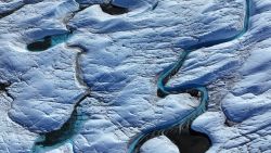 KANGERLUSSUAQ, GREENLAND - JULY 11: In this aerial view rivulets of meltwater snake across the surface of the melting Isunnguata Sermia glacier of the Greenland Ice Sheet on July 11, 2024 near Kangerlussuaq, Greenland. A team of scientists has observed that increasing amounts of meltwater on the surface of the glacier making their way to the glacial flows underneath are leading to a rising output of methane from Isunnguata Sermia. Earlier this year other scientists published a study in which they concluded that Greenland’s glaciers, which all stem from the Greenland Ice Sheet, have retreated about 20% more than previously estimated. Of the 200 glaciers included in the study, only one has grown since 1985. Overall, the amount of glacial ice melting globally has increased markedly over the past 30 years as global warming continues to intensify. According to the European Space Agency, the Earth lost 28 trillion tons of ice between 1994 and 2017, enough to cover the entire United Kingdom with an ice sheet 100 meters thick. Since 2017 the rate of ice loss has increased to 1.3 trillion tons annually, up from 0.8 trillion tons in the 1990s. According to the Programme for Monitoring of the Greenland Ice Sheet (PROMICE), the Greenland Ice Sheet has been losing mass continuously since 1996, with an accumulated loss since 1986 approaching 6,000 metric gigatons, or six trillion tons. (Photo by Sean Gallup/Getty Images)