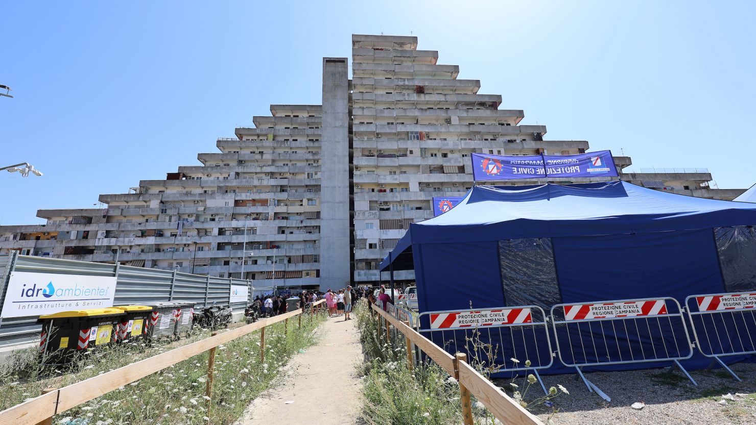 Civil Protection tents in front of the Le Vele building in the Scampia district of Naples, where two people died and thirteen were injured.
