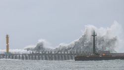 Waves break on the coasline in Yilan on July 24, 2024 as Typhoon Gaemi approaches Taiwan. Taiwan closed schools, suspended the stock market, and declared a typhoon holiday on July 24 as Gaemi barrelled towards the island, bringing torrential rains and whipping winds to its northeast. (Photo by I-Hwa CHENG / AFP) (Photo by I-HWA CHENG/AFP via Getty Images)