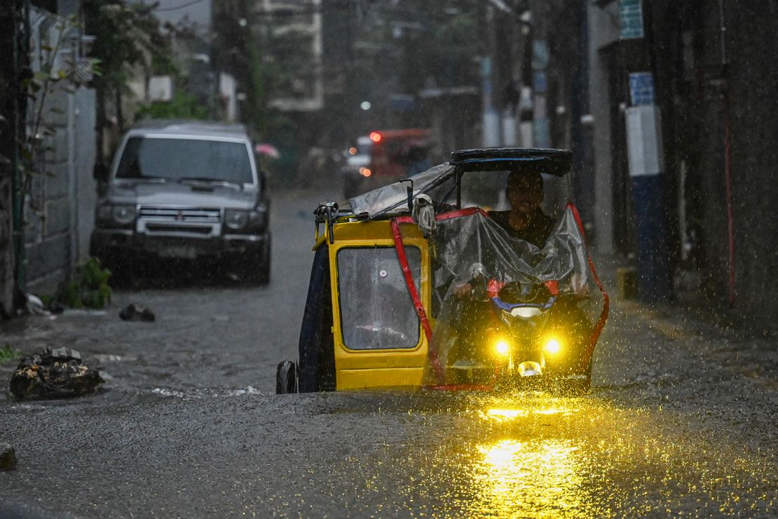 Streets flood in the Philippine capital Manila on July 24, 2024 amid heavy rains brought by Typhoon Gaemi.