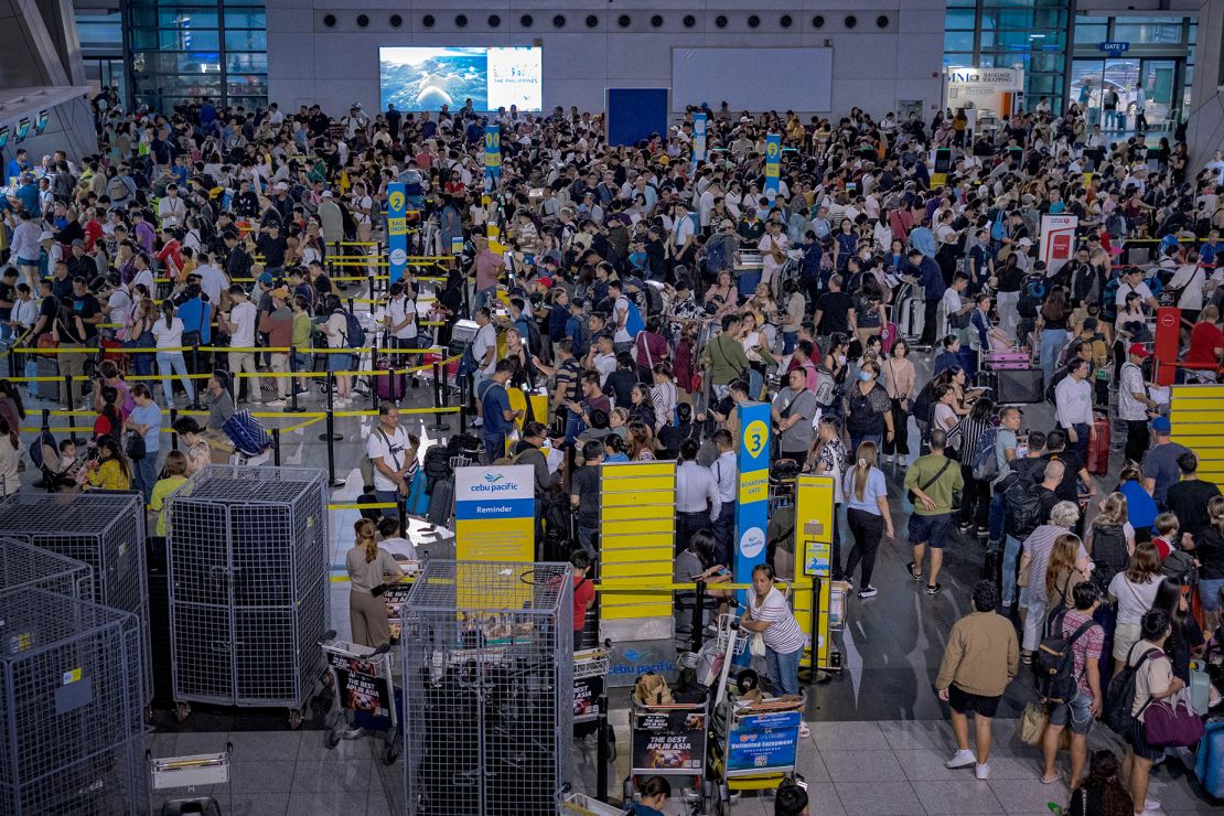 Long queues of passengers form at the check-in counters at Ninoy Aquino International Airport in Manila, Philippines on July 19.