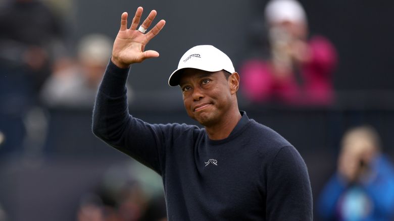 Tiger Woods acknowledges the crowd as he walks off the 18th green after finishing his second round of the Open Championship at Royal Troon in Scotland.