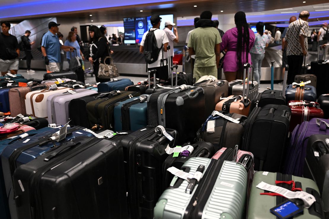 Bags await reunification with their owners in the Delta Air Lines baggage claim area Los Angeles International Airport on July 24