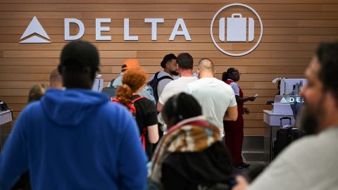 People looking for missing bags wait in line to speak with Delta Air Lines baggage in the Delta Air Lines baggage claim area Los Angeles International Airport (LAX) on July 24, 2024 in Los Angeles, California.