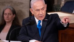 Israeli Prime Minister Benjamin Netanyahu acknowledges Israeli soldiers while addressing a joint meeting of Congress at the US Capitol on July 24, 2024 in Washington, DC. (Photo by ROBERTO SCHMIDT / AFP) (Photo by ROBERTO SCHMIDT/AFP via Getty Images)