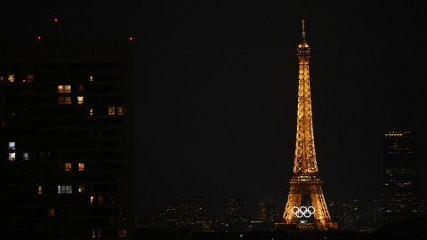 This photograph shows the Olympic rings displayed on the lighten up Eiffel Tower in Paris on July 24, 2024, ahead of the Paris 2024 Olympic and Paralympic Games. (Photo by Paul ELLIS / AFP)