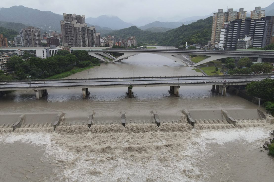 An aerial view shows Xindian river's rising water level at New Taipei City as typhoon Gaemi passes Taiwan on July 25, 2024.