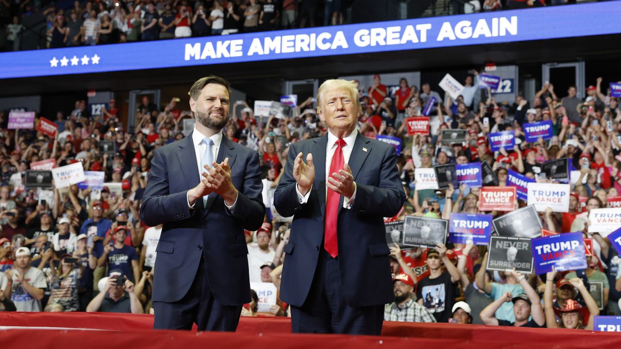 US Sen. JD Vance, left, and former President Donald Trump attend a campaign rally in Grand Rapids, Michigan, in July.