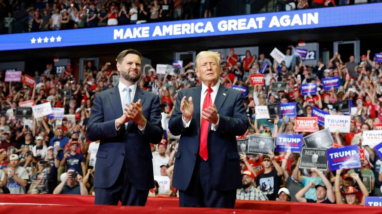 Republican presidential nominee, former U.S. President Donald Trump stands onstage with Republican vice presidential candidate, Sen. J.D. Vance (R-OH) during a campaign rally at the Van Andel Arena on July 20, 2024 in Grand Rapids, Michigan.