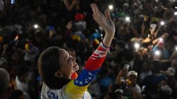 Venezuelan opposition leader Maria Corina Machado waves during the campaign closing rally of presidential candidate Edmundo Gonzalez Urrutia in Caracas on July 25, 2024.