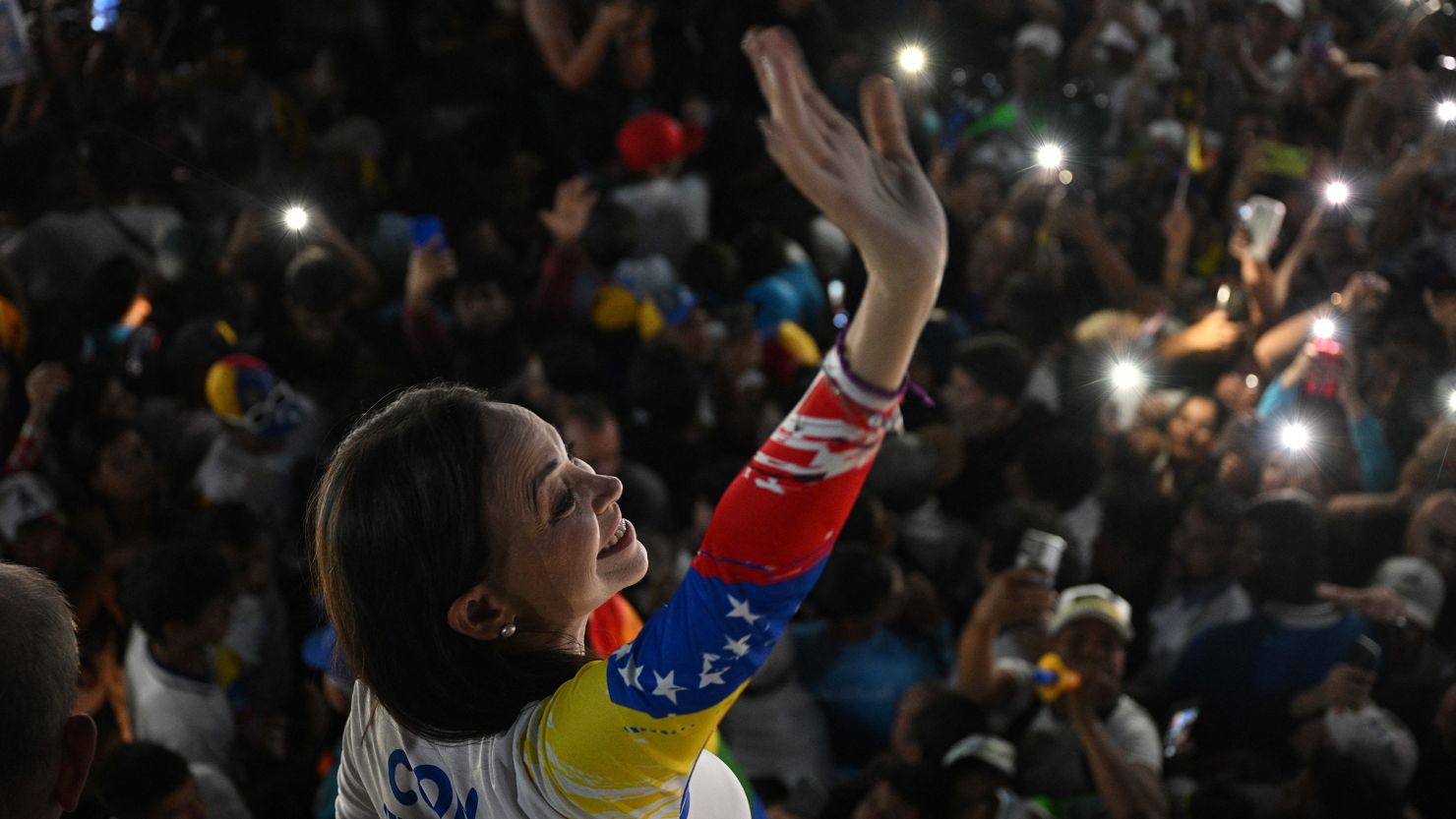 Venezuelan opposition leader Maria Corina Machado waves during the campaign closing rally of presidential candidate Edmundo Gonzalez Urrutia in Caracas on July 25, 2024.