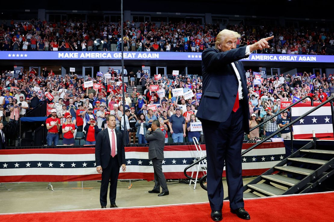 Former President Donald Trump walks offstage after speaking at a campaign rally in Grand Rapids, Michigan, on July 20, 2024.