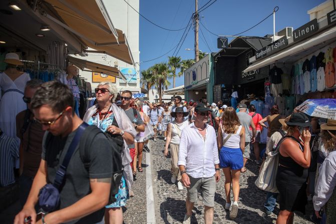 <strong>Fira: </strong>Crowds of tourists walk through Santorini's capital, Fira, on July 19.