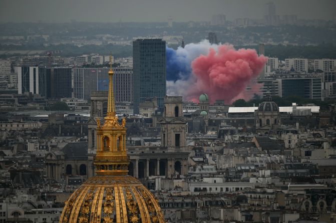 The colors of the French national flag are seen at the start of the ceremony.