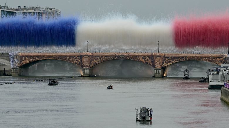 Fireworks in the French national colours explode over Pont d'Austerlitz during the opening ceremony of the Paris 2024 Olympic Games in Paris on July 26, 2024.