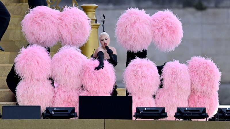 Lady Gaga flutters in dazzling feathery performance to kick off Olympic Games in Paris | CNN