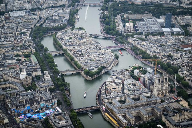 This aerial photo shows the Notre Dame cathedral as boats pass by on the Seine. As part of the ceremony, <a >the bells of Notre Dame rang for the first time</a> since the iconic cathedral was gutted by fire in 2019. It is 90% restored.