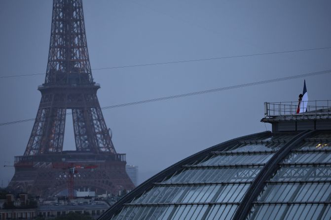 French mezzo-soprano opera singer Axelle Saint-Cirel <a La Marseillaise,"</a> France's national anthem, on the roof of the Grand Palais.