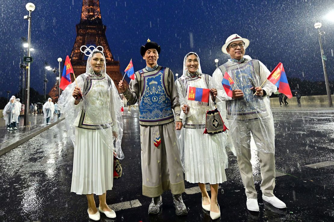 Members of Mongolia's delegation pose on the Jena Bridge during the opening ceremony of the Paris 2024 Olympic Games on July 26, 2024.