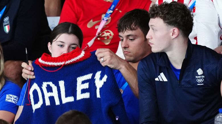 Great Britain's Tom Daley knitting as he watches the Women's Synchronised 3m Springboard Final at the Aquatics Centre on the first day of the 2024 Paris Olympic Games in France. Picture date: Saturday July 27, 2024. (Photo by Mike Egerton/PA Images via Getty Images)