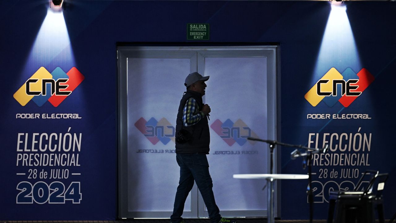 A man walks inside the media center of the National Electoral Council (CNE) in Caracas on July 27, 2024. . Venezuela will hold presidential elections on July 28, 2024. (Photo by JUAN BARRETO / AFP) (Photo by JUAN BARRETO/AFP via Getty Images)