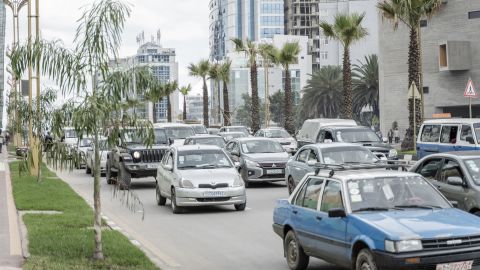 Cars drive past by the newly planted trees and light installations in Addis Ababa, Ethiopia, on July 27, 2024. Addis Ababa's urban renewal brings modern infrastructure and new challenges, with steep fines for traffic violations and new regulations. (Photo by Amanuel Sileshi / AFP) (Photo by AMANUEL SILESHI/AFP via Getty Images)