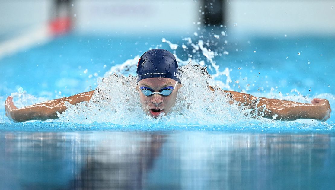 France's Léon Marchand competes in a heat of the men's 400m individual medley swimming event during the Paris Games.