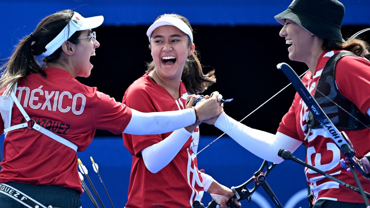 TOPSHOT - (fromL) Mexico's Ana Vazquez, Mexico's Angela Ruiz and Mexico's Alejandra Valencia react during the archery Women's team quarterfinal during the Paris 2024 Olympic Games at the Esplanade des Invalides in Paris on July 28, 2024. (Photo by Punit PARANJPE / AFP) (Photo by PUNIT PARANJPE/AFP via Getty Images)