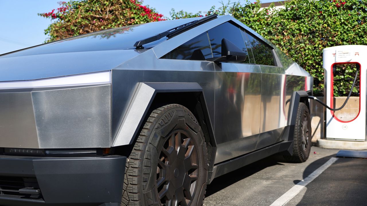 A Tesla Cybertruck recharges at a Tesla dealership on July 24, 2024 in Burbank, California.