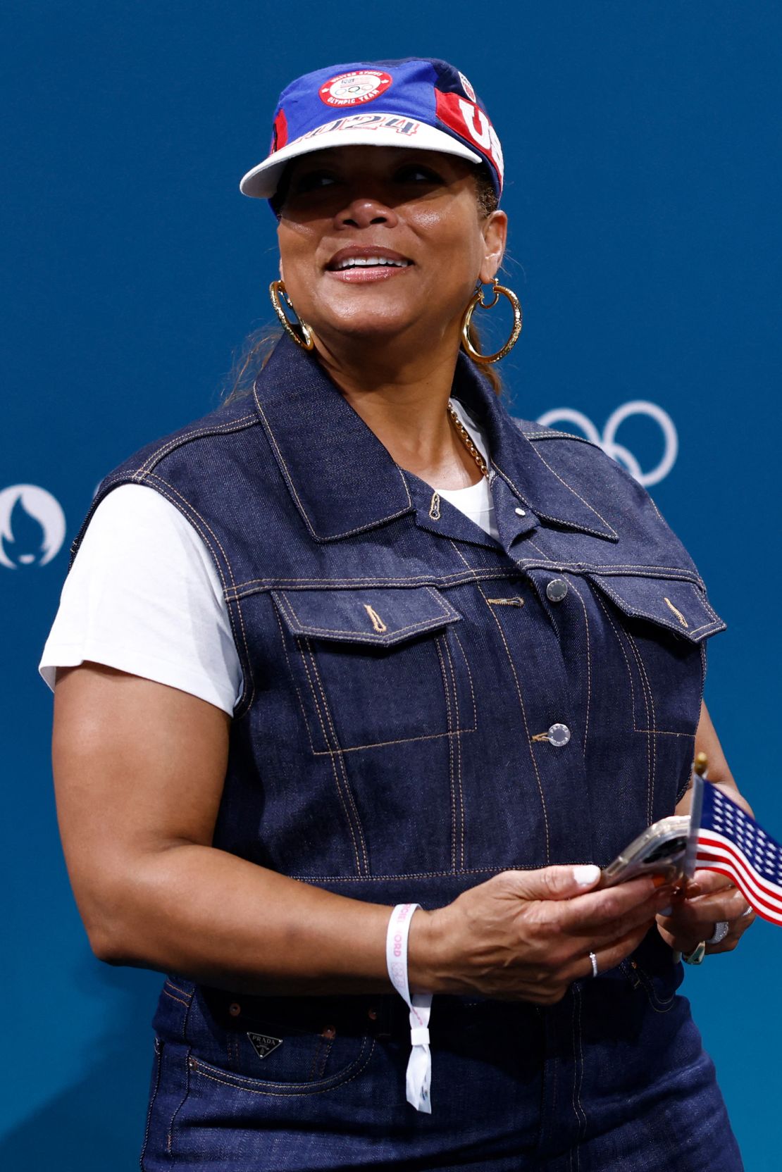 Queen Latifah opted for a double denim look and gold hoops at the basketball match between Serbia and USA on July 28.