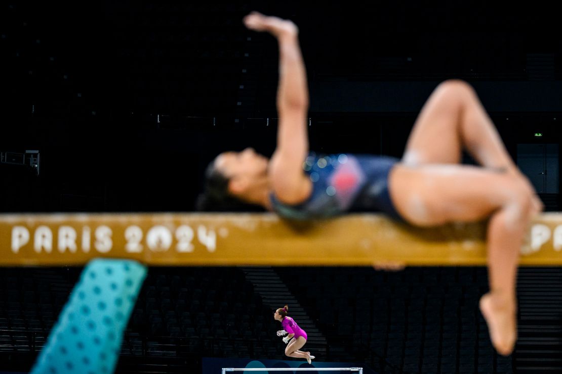 Ahtziri Sandoval (center background) of Team Mexico trains on the uneven bars during a gymnastics training session ahead of the Paris 2024 Olympics Games.