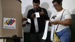 Election staffers count votes after polling stations closed during the presidential election, in Caracas on July 28, 2024. Venezuelans vote Sunday between continuity in President Nicolas Maduro or change in rival Edmundo Gonzalez Urrutia amid high tension following the incumbent's threat of a "bloodbath" if he loses, which polls suggest is likely. (Photo by Raul ARBOLEDA / AFP) (Photo by RAUL ARBOLEDA/AFP via Getty Images)