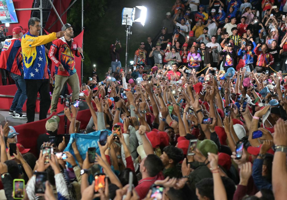 Venezuelan President Nicolas Maduro celebrates with supporters following the election results in Caracas on July 29, 2024.