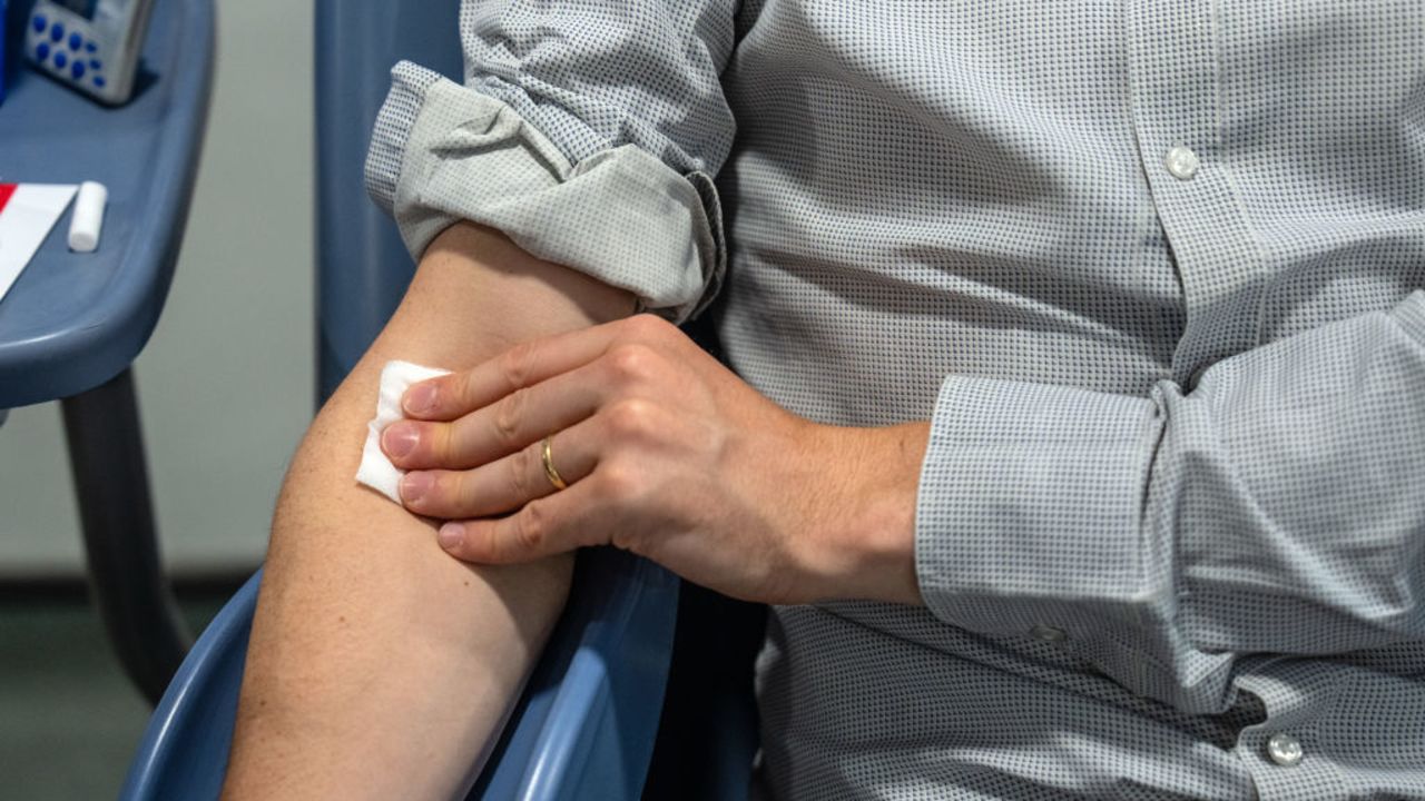 LONDON, ENGLAND - JULY 29: A man holds a gauze after a blood donation on July 29, 2024 at the West End Donor Centre in London, England. Stock levels of O-type blood have been drained across England as the system copes with a ransomware attack last month on pathology firm Synnovis, which contracts with a number of major hospitals. The hospitals had used the firm to check the blood type of transfusion patients, but since the cyberattack the hospitals have not been able to run these checks as quickly, forcing doctors to use universal O-type blood. (Photo by Carl Court/Getty Images)