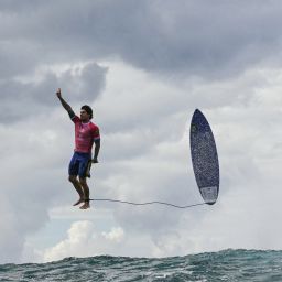 TOPSHOT - Brazil's Gabriel Medina reacts after getting a large wave in the 5th heat of the men's surfing round 3, during the Paris 2024 Olympic Games, in Teahupo'o, on the French Polynesian Island of Tahiti, on July 29, 2024. (Photo by Jerome BROUILLET / AFP) (Photo by JEROME BROUILLET/AFP via Getty Images)