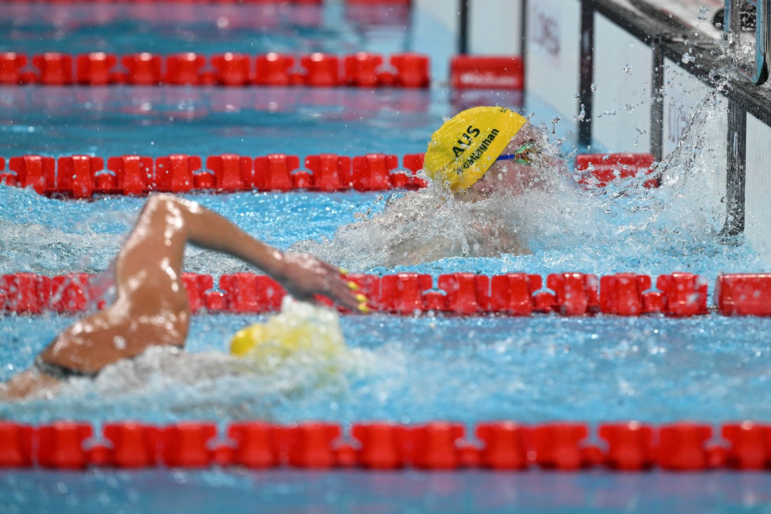 Mollie O'Callaghan beats fellow Australian Ariarne Titmus to the wall <a >to win the 200-meter freestyle</a> on July 29. O'Callaghan finished in 1:53.27, topping Titmus’ Olympic record from three years ago. Titmus won the silver.