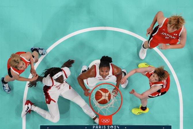 From left, Japan's Saori Miyazaki, the United States' Kahleah Copper, the United States' Alyssa Thomas, Japan's Saki Hayashi and Japan's Maki Takada watch the ball go through the hoop during their first basketball game in Paris on July 29. <a >Team USA won 102-76</a> in what was a rematch of the gold-medal game three years ago. The United States has won 56 consecutive Olympic games.