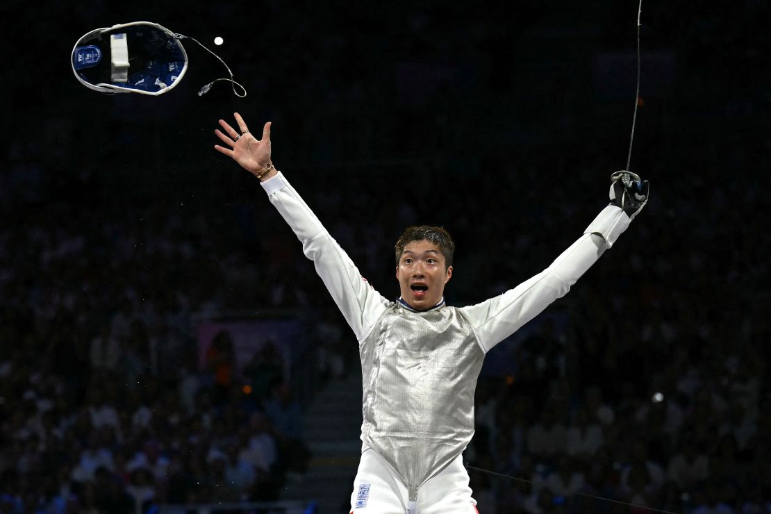 Hong Kong fencer Cheung Ka Long celebrates after winning a point in the final.