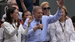 Venezuelan opposition presidential candidate Edmundo Gonzalez Urrutia talks to supporters as Venezuelan opposition leader Maria Corina Machado (L), his wife Mercedes Lopez (R) and his daughter Mariana Gonzalez (2nd R) listen during a rally in front of the United Nations headquarters in Caracas on July 30, 2024. Venezuela braced for new demonstrations on July 30, after four people died and dozens were injured when the authorities broke up protests against President Nicolas Maduro's claim of victory in the country's hotly disputed weekend election. (Photo by Yuri CORTEZ / AFP) (Photo by YURI CORTEZ/AFP via Getty Images)