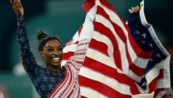 US' Simone Biles celebrates after team USA won the artistic gymnastics women's team final during the Paris 2024 Olympic Games at the Bercy Arena in Paris, on July 30, 2024. (Photo by Loic VENANCE / AFP) (Photo by LOIC VENANCE/AFP via Getty Images)