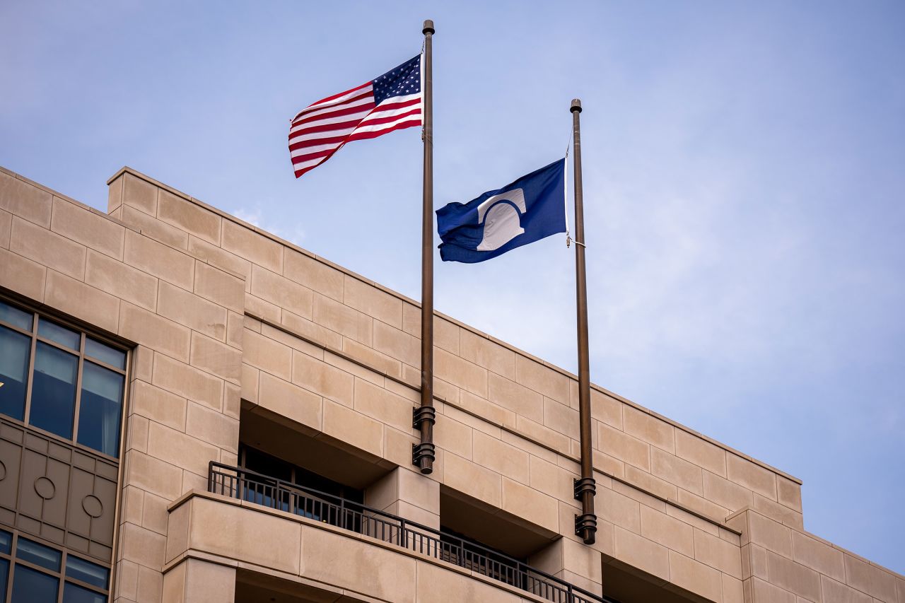 The American and Heritage Foundation flags fly over the Heritage Foundation building in Washington, DC, on July 30.