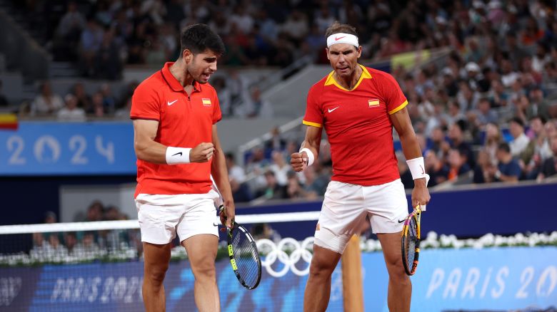 PARIS, FRANCE - JULY 27: Rafael Nadal (R) and partner Carlos Alcaraz of Team Spain celebrate against Andres Molteni and Maximo Gonzalez of Team Argentina during the Men's Doubles first round match on day one of the Olympic Games Paris 2024 at Roland Garros on July 27, 2024 in Paris, France. (Photo by Clive Brunskill/Getty Images)