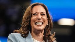 US Vice President and 2024 Democratic presidential candidate Kamala Harris smiles as she takes the podium to speak at a campaign rally in Atlanta, Georgia, on July 30, 2024.