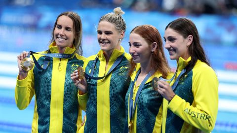 Team Australia pose with their medals after winning the Women's 4x100m Freestyle Relay Final in Paris on July 27, 2024.