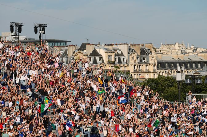 Fans show their support during a beach volleyball match on July 28.