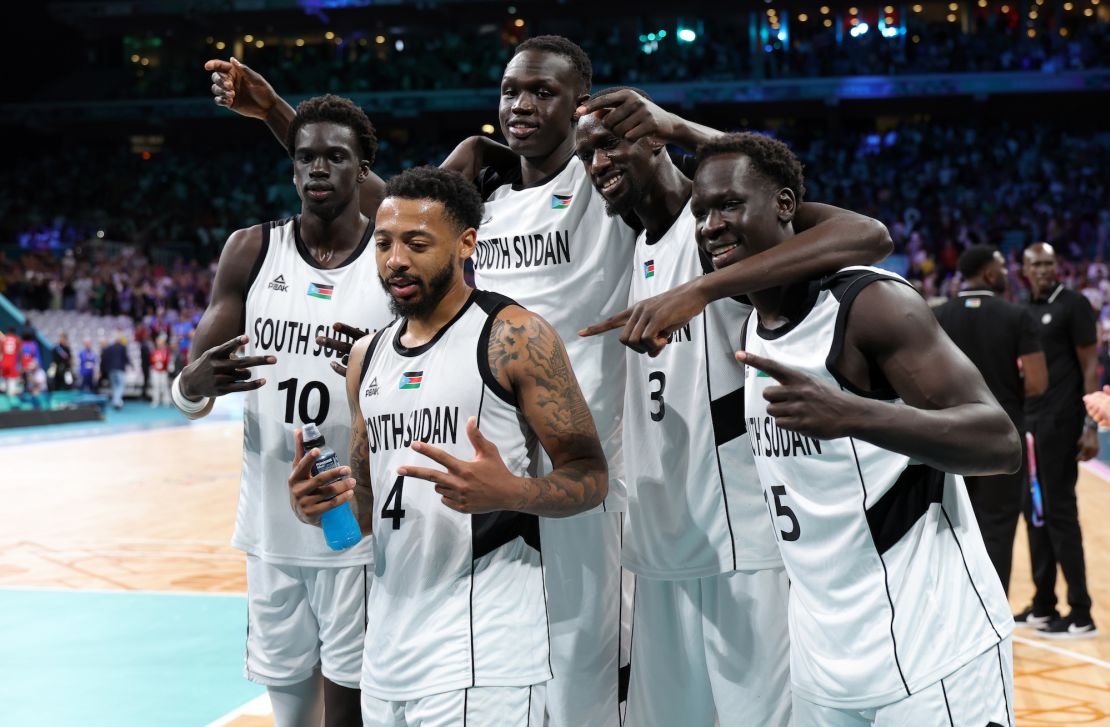 South Sudan players celebrate after defeating Puerto Rico.